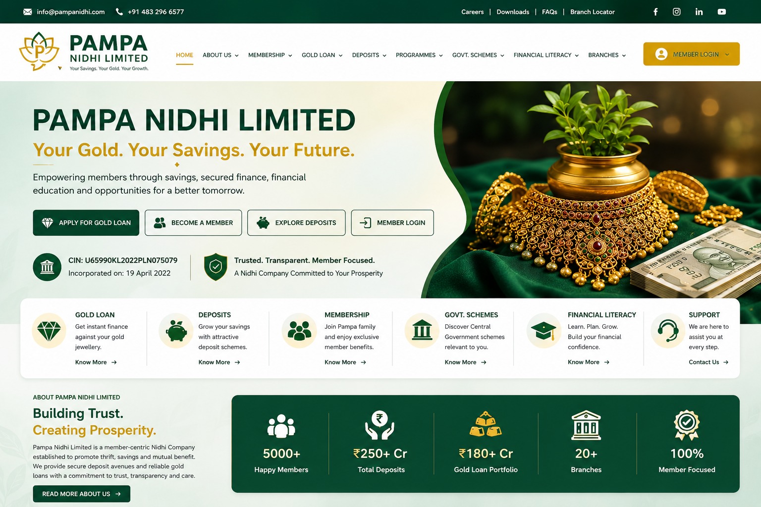 Gold jewellery and a growing plant on a green cloth, representing savings and prosperity